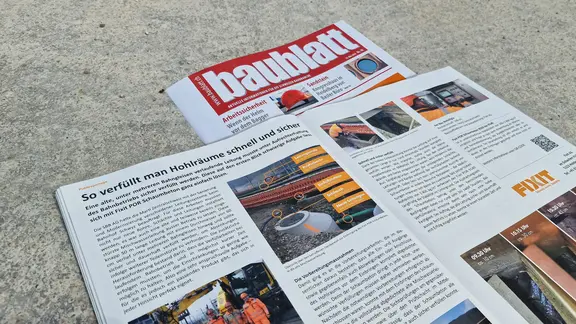 Titelblatt des Magazins "Baublatt" mit dem aufgeschlagenen Artikel zur Fixit POR Leitungsverfüllung am Bahnhof Schwyz